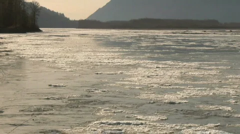 Fraser River IceFlow Low WS Sunset Winter Stock Footage 344906