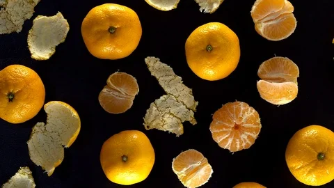Frash tangerines on black background. Video stock 70049643