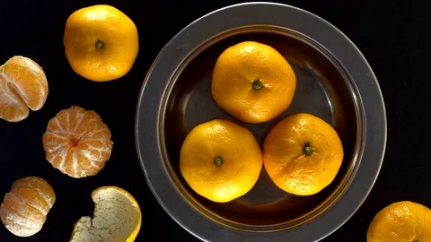 Frash tangerines on black background. Stock-Footage 70080935