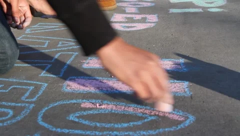 Fraternity students writing on pavement Stock Footage 1047682