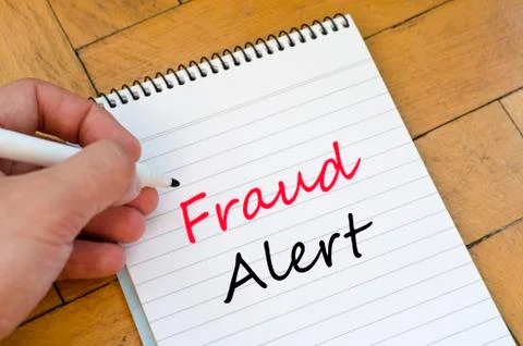 Fraud alert concept on notebook Stock Photos