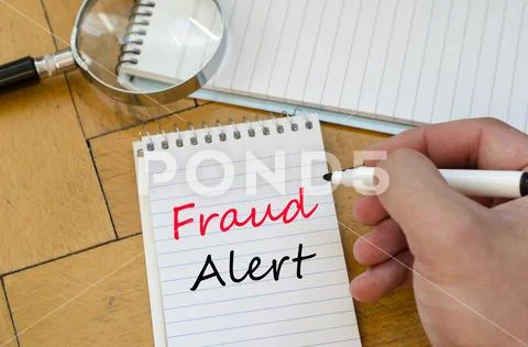 Fraud alert concept on notebook Stock Photos