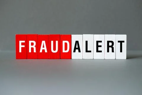 Fraud alert - word concept on building blocks, text Stock Photos