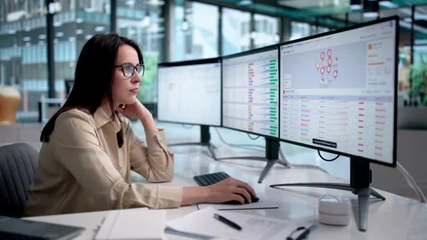 Fraud Analyst Monitors Real-time Transaction Graphs Stock Footage 338170932
