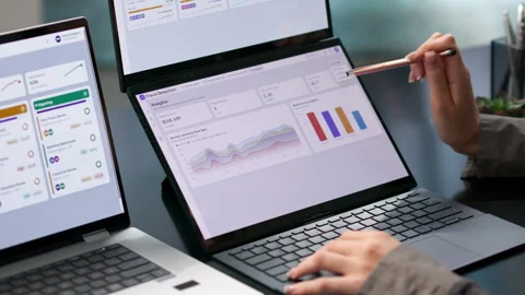 Fraud Analyst Reviews Real-time Transaction Patterns Stock-Footage 345329765