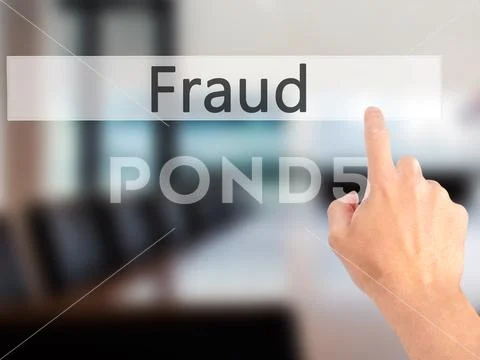Fraud - Hand pressing a button on blurred background concept on Stock Photos