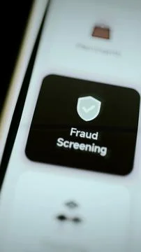 Fraud screening check shield on black tile Stock Photos