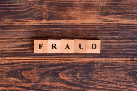 Fraud word concept on cubes. Concept of business, technology, Internet and ne Stock Photos
