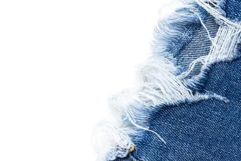 Frayed ripped jeans on a white background. Denim frame with empty space Stock Photos