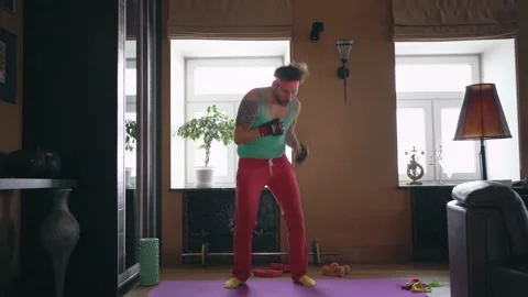 A freak guy doing sports alone at home Stock Footage 149050871