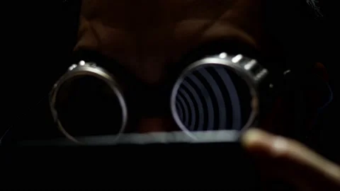 Freak man hypnotized by a spiral hypnotic effect looking at the smartphone. Stock Footage 157923215