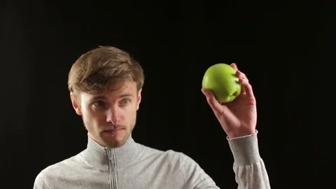 Freaky comic caucasian dancing with green apple - healthy food lifestyle Stock Footage 70306958