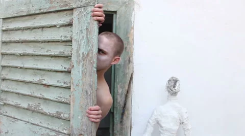 Freaky guy appearing behind the door 1/2 Stock Footage 48872910