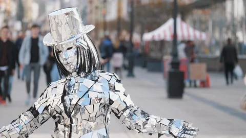 Freaky lady in white segmented sparkling hat and suit Stock Footage 108572287