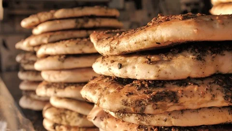 Freashly baked arab flatbreads at Mahane Yehuda Market in Jerusalem Stock-Footage 126013636