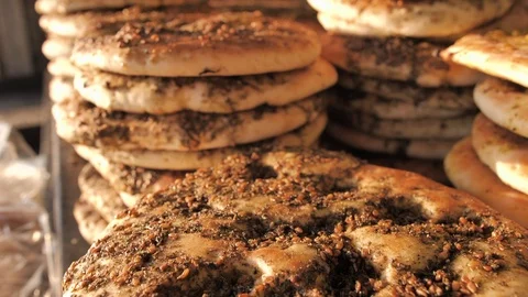 Freashly baked arab flatbreads at Mahane Yehuda Market in Jerusalem Stock Footage 126301856