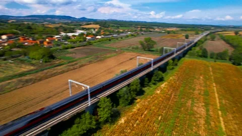 Freccia Rossa train-drone flight view-Valdichiana valley Tuscany Italy 4K Stock Footage 237875282