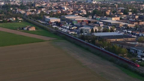 Frecciarossa high speed train passing Fiorenzuola d’Arda with Apennines Stock Footage 334084611