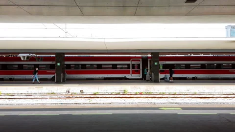 Frecciarossa train stopped at the station with passengers preparing to board Stock Footage 160366876