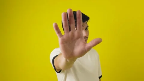 Freckled man making stop sign with his hands with angry expression on a yel.. Stock Footage 312234928