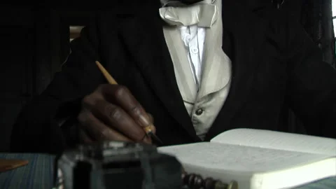 Frederick Douglass recreation -- Tabletop, African-American writing a book Stock Footage