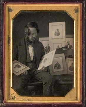 Frederick Langenheim Looking at Talbotypes ca. 184951 W. &amp; F. Langenheim In.. Stock Photos