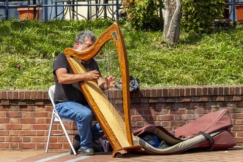 Frederick, MD, USA 04-07-2021:  Closeup image of a street musician performing Stock Photos