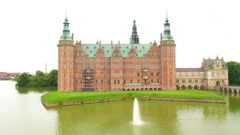 Frederiksborg castle in Denmark -  Drone fly back shot Stock Footage 295487423
