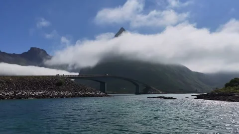 Fredvang bridges with clouds passing over mountain peak in lofoten islands Stock Footage 317177794