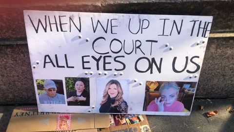 Free Britney protest sign "When We Up in the Court, All Eyes on Us". Stock Footage 185642953