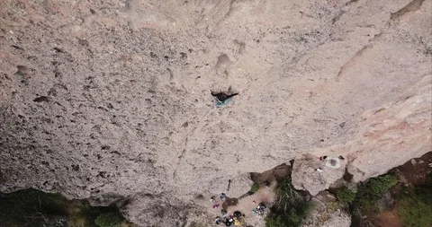 Free climbing group on the slope of a rock wall Stock Footage