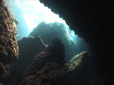 Free diver apnea man diving underwater in caves Stock Footage
