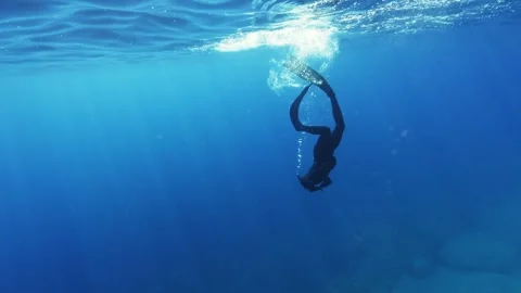 Free Diver Exploring Deep Ocean Stock Footage 249164685