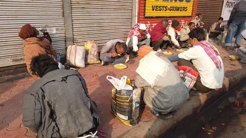 Free food distribution by Khichdi Baba temple Stock Footage 116551053