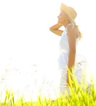 Free from hayfever. A beautiful young blonde woman standing in a meadow wearing Stock Photos