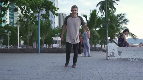 Free runner training parkour jump in urban city. Athlete man practicing free Stock Footage 111179508