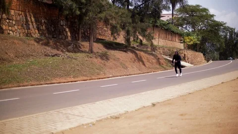 Free running young man practicing parkour in the road Stock Footage 117688013