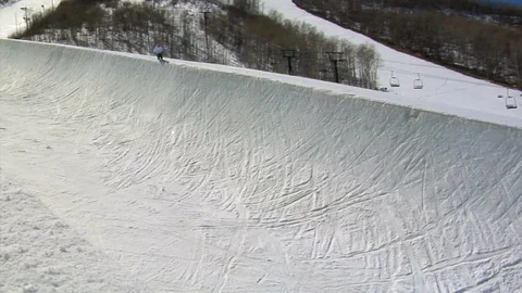 Free skier performs aerial in half pipe in slow motion, Park City, Utah. Video stock 106791006