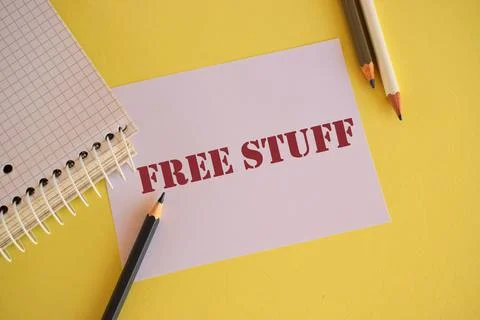 FREE STUFF text written on paper. Concept meaning something that is given to Stock Photos