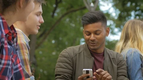Free young people communicating with each other friendly outdoors Stock Footage 74635138