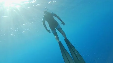 Freediver Floating To Surface Stock Photos