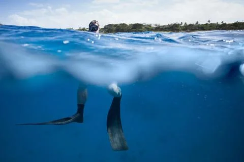 Freediver at the surface of the ocean Stock Photos