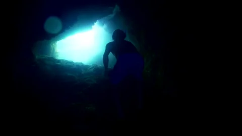 Freediving with scuba gear in a cave. Cape Palos Cartagena Murcia Spain Stock-Footage 130908043