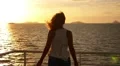 Freedom and Serenity Concept. Woman Embracing the Sun. Slow Motion. HD Footage