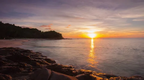 Freedom beach sunset  light panorama 4k time lapse phuket island thailand Stockbeeldmateriaal 66539810