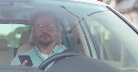 Freedom of the open road. Front view of joyful young man relaxing on the front Video stock 157359660