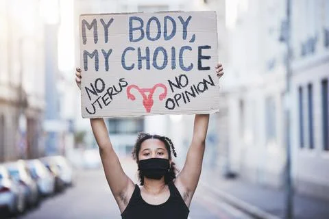 Freedom, protest and abortion with a woman and a poster, fighting for human Stock Photos