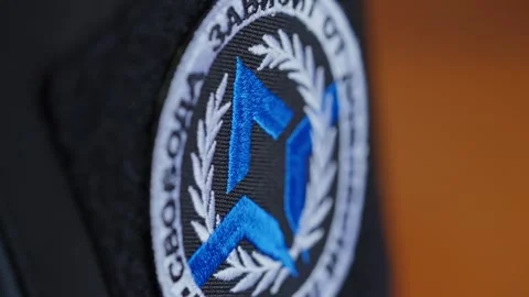 Freedom of Russia Legion patch stitched onto a uniform, standing out against Stock Footage 304588408