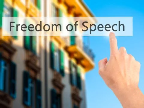Freedom of Speech - Hand pressing a button on blurred background concept on v Stock Photos