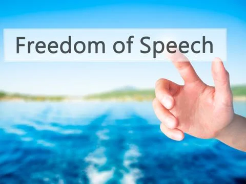 Freedom of Speech - Hand pressing a button on blurred background concept on v Stock Photos
